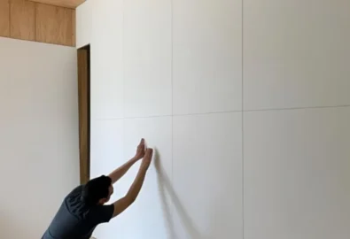Install drywall over paneling
